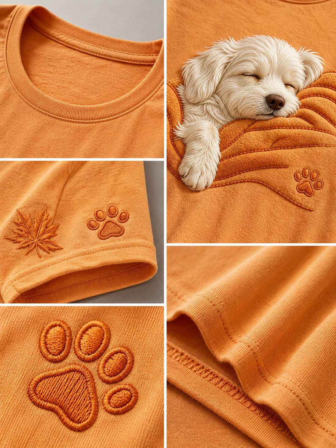 An orange short-sleeve t-shirt on a wooden hanger, featuring a large graphic of a sleeping white dog wrapped in an orange blanket. The shirt is styled with blue jeans, set against a blurred autumn background of fallen leaves and warm sunlight.