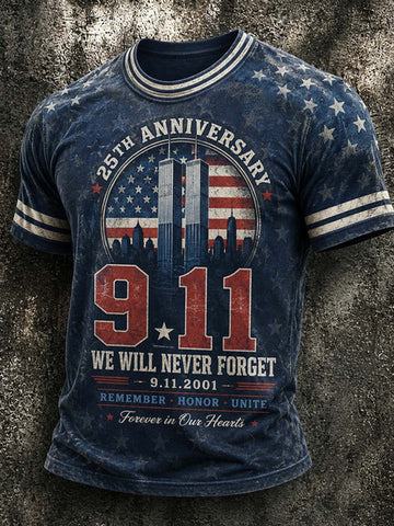 A blue distressed graphic t-shirt featuring the 9/11 memorial design with '25th Anniversary', '9.11', 'We Will Never Forget', and 'Remember Honor Unite Forever in Our Hearts' on a textured gray background.