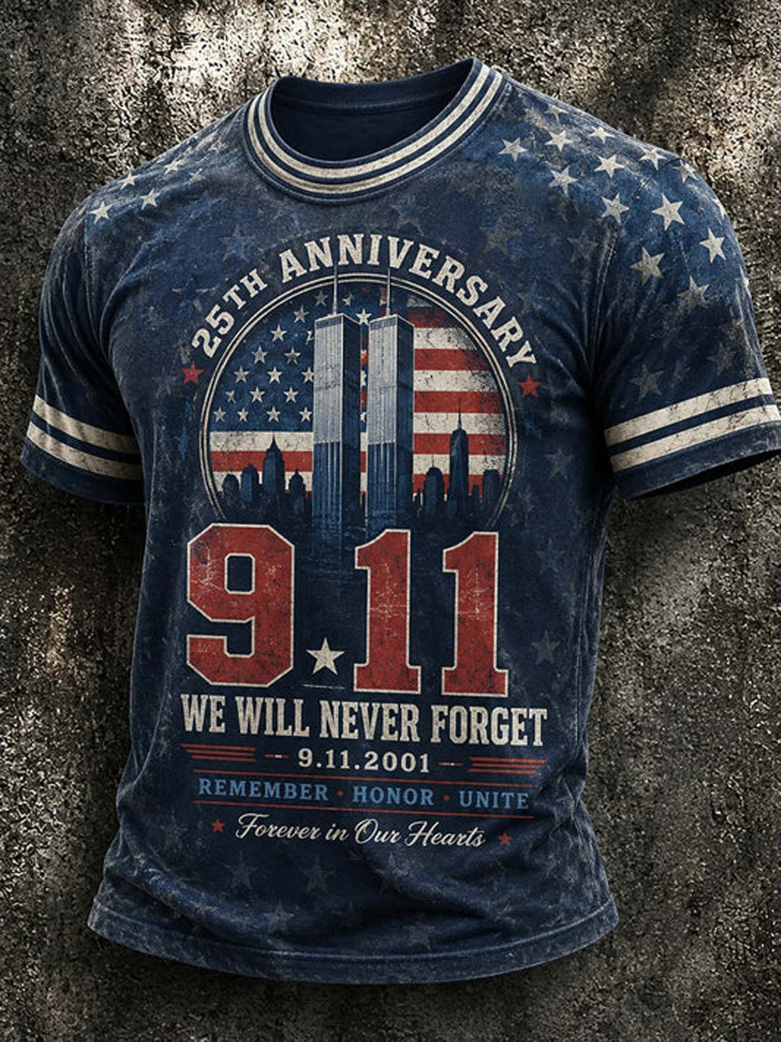 A blue distressed graphic t-shirt featuring the 9/11 memorial design with '25th Anniversary', '9.11', 'We Will Never Forget', and 'Remember Honor Unite Forever in Our Hearts' on a textured gray background.
