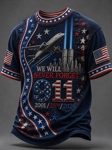 A navy blue short-sleeve t-shirt with a patriotic 9/11 memorial graphic. The design features red and white stripes, white stars, an airplane flying above the Twin Towers, and the text 'WE WILL NEVER FORGET 9/11 2001/25th/2026'.