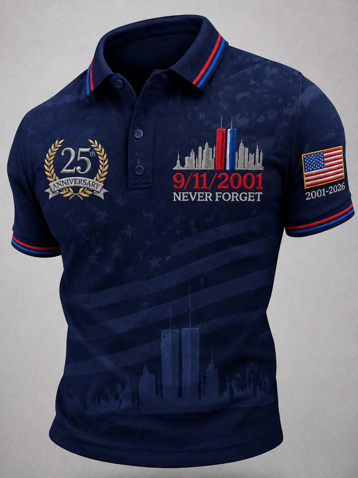 A navy blue short-sleeve polo shirt with patriotic 9/11 themed graphics, including the Twin Towers, '25 Anniversary', '9/11/2001 NEVER FORGET', and a US flag on the sleeve, shown on a neutral gray background.