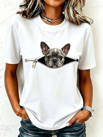 Person wearing a white t-shirt with a graphic of a dog peeking out from a zipper