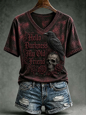 A gothic-style short-sleeve V-neck t-shirt with a distressed dark red and black acid-wash finish, featuring a graphic print of a raven, skull, and roses with the text 'Hello Darkness My Old Friend'. The shirt is displayed on a wooden hanger against a dark gray textured background, styled with distressed denim shorts.